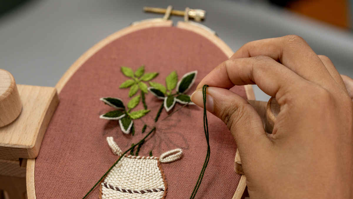 Crafters making Hand Embroidery and flowers vase